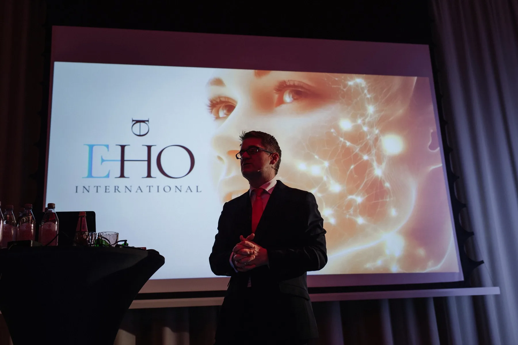 Atmospheric stage silhouette during an EHO International presentation